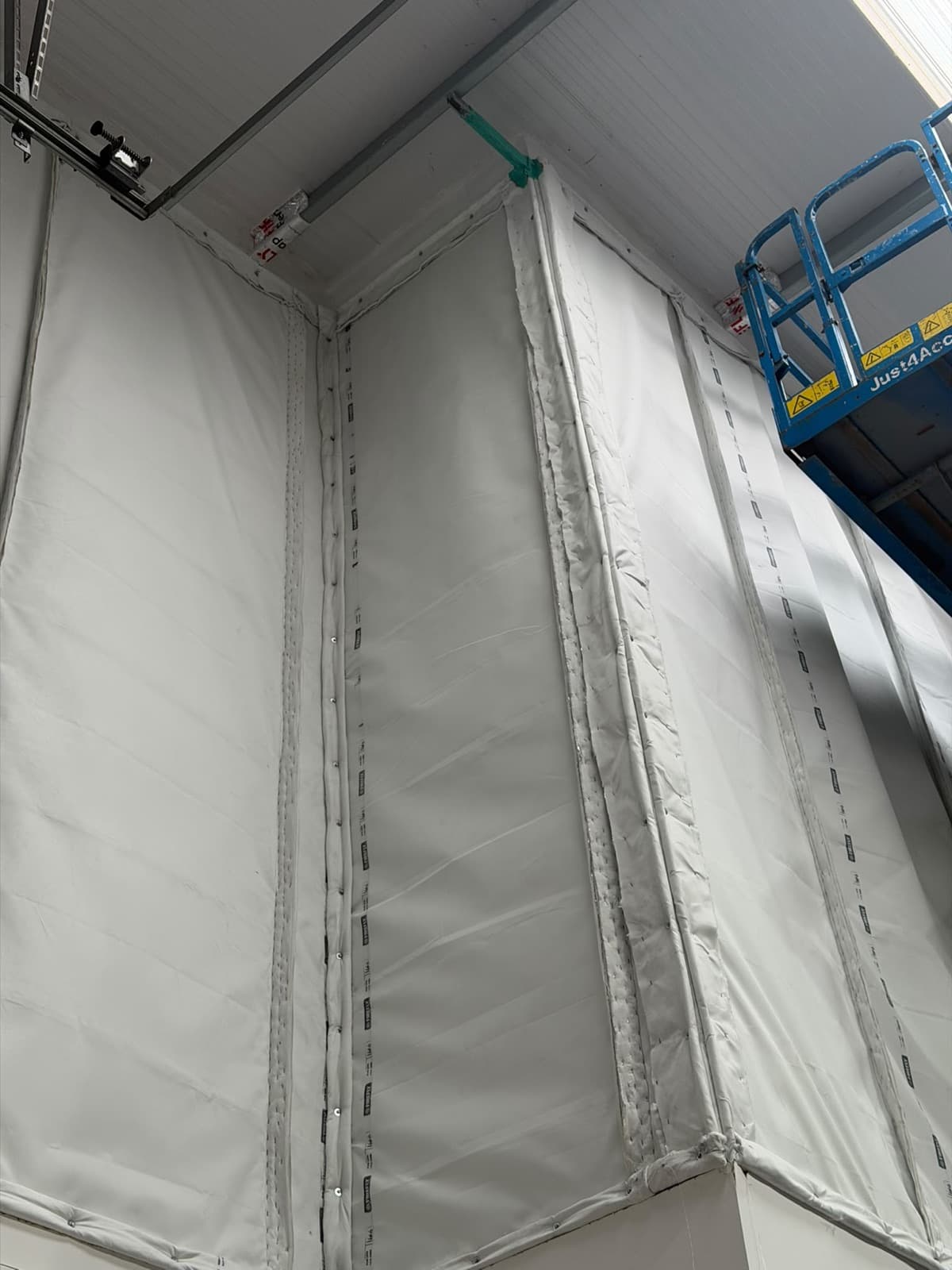 Stitched barrier panels and the corner return meeting the roof deck